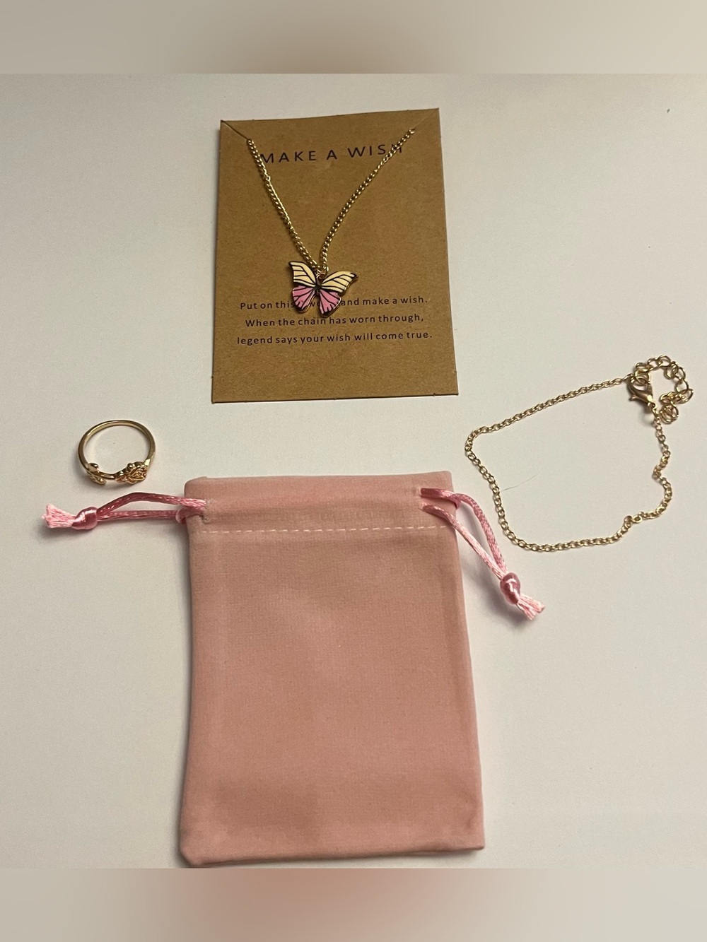 Gold Butterfly Necklace with Pink Enamel Accent